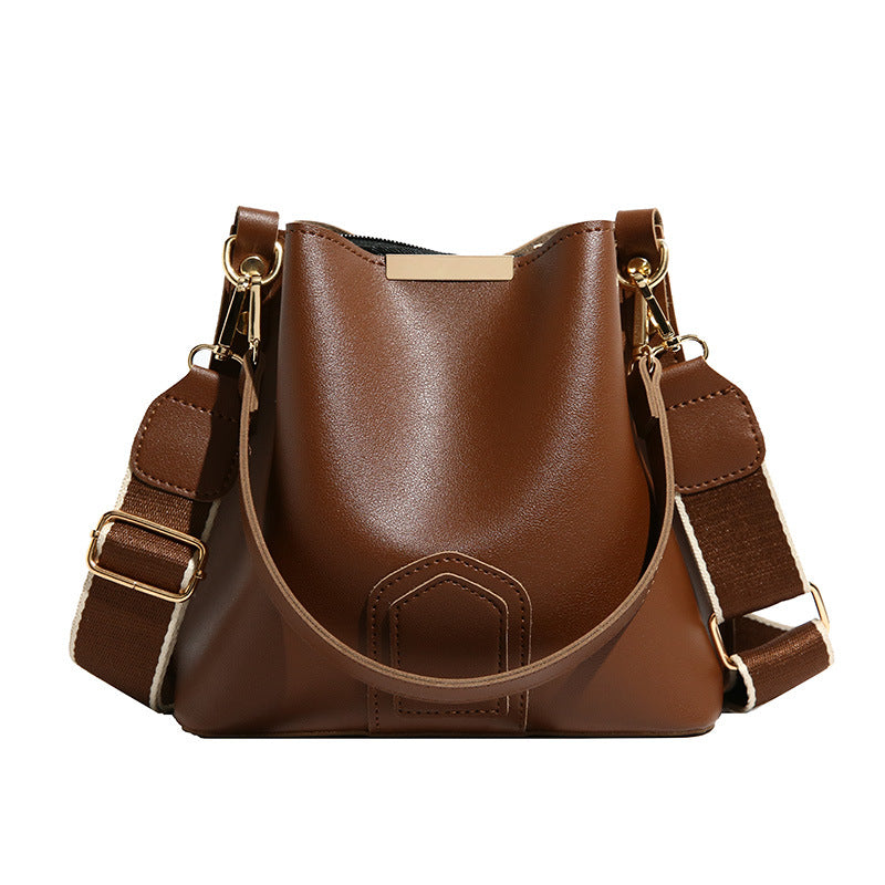 Nuevo y moderno bolso cubo cruzado — Un bolso de mano y de hombro versátil y elegante