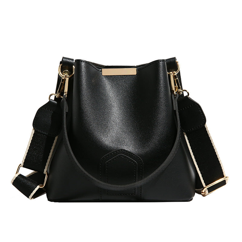Nuevo y moderno bolso cubo cruzado — Un bolso de mano y de hombro versátil y elegante