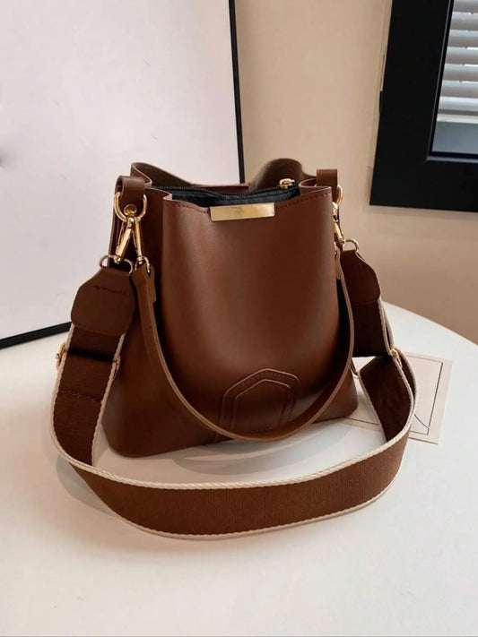 Nuevo y moderno bolso cubo cruzado — Un bolso de mano y de hombro versátil y elegante